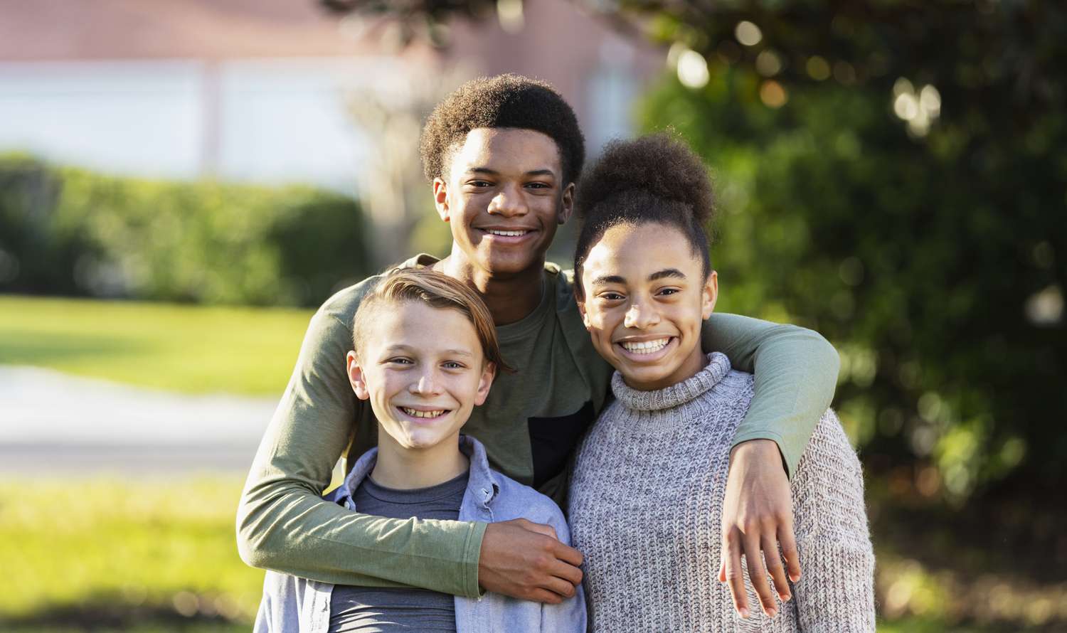 Group of smiling stepsiblings