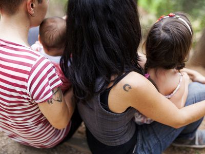 Back view of lesbian couple with two children