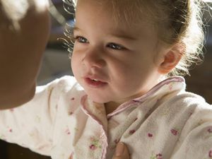 Mother talking to 3 year old daughter.