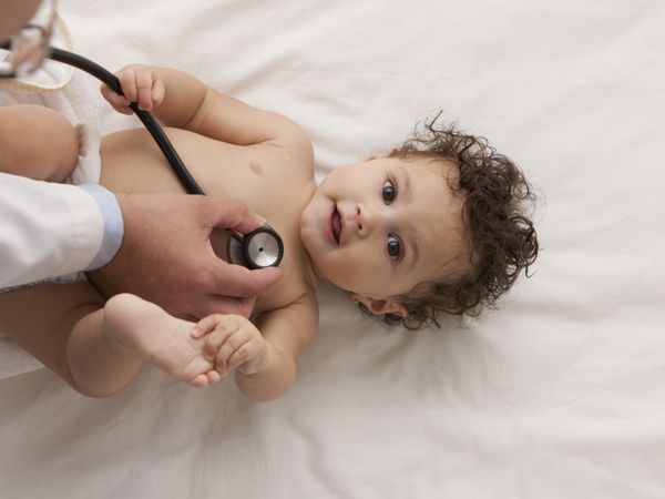 baby being examined by a pediatrician