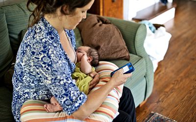 Woman using breastfeeding tracker