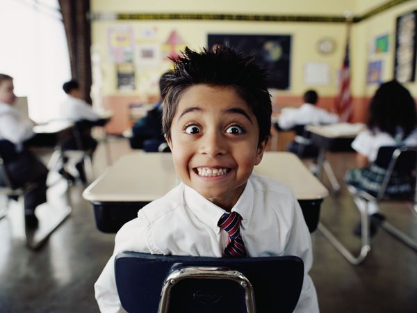 Excited boy in classroom