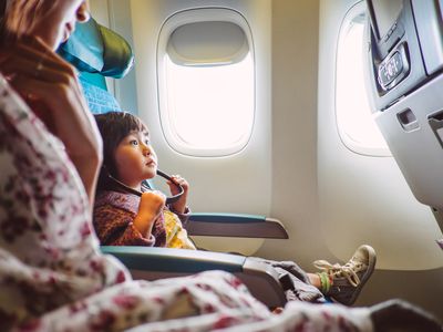 Mom & child riding on the airplane