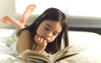 Little Girl Reading a Book