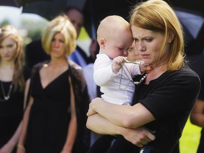 Mother and baby at funeral