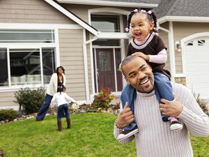 A family of four having a scavenger hunt in their yard