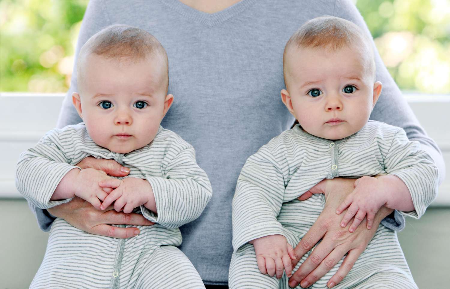 twin babies in matching onesies