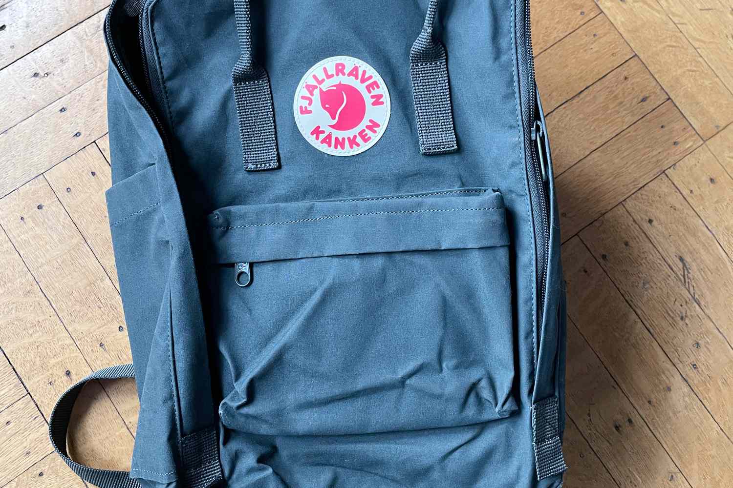 The Fjallraven KÃ¥nken backpack on the floor