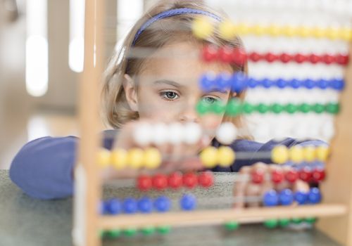 girl using abacus