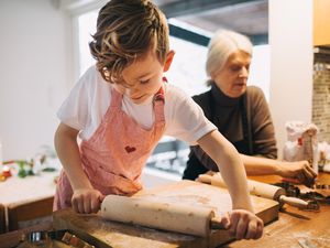 Child kneading dough