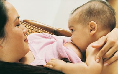 Woman breastfeeding her son