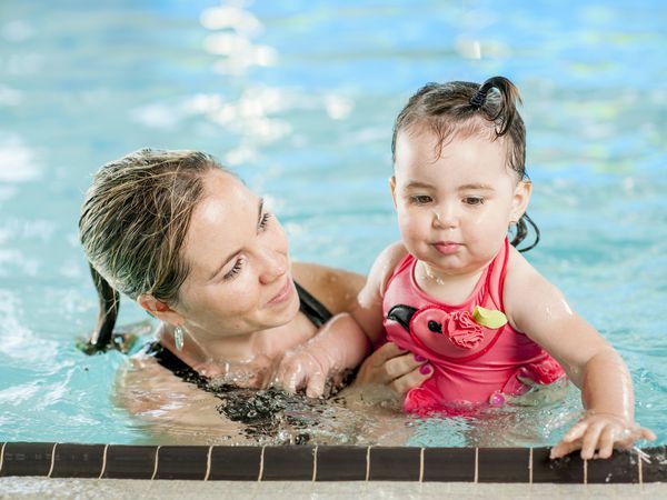 Woman and toddler swimming.