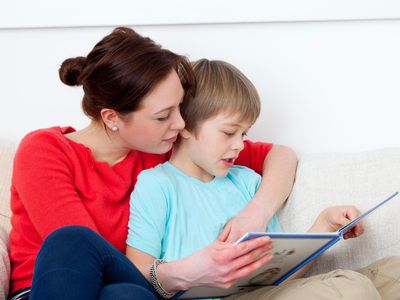 Mother and son reading together