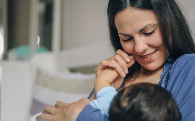 mother breastfeeding newborn baby