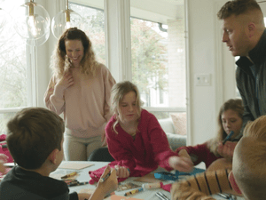 The Merrifield family gathered around the kitchen table creating chore charts