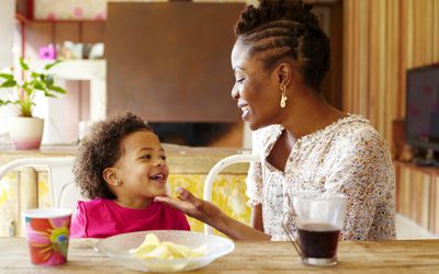 Mother and daughter at kitchen table