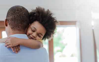 father hugging child