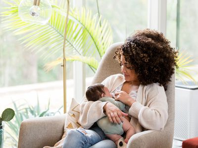 woman breastfeeding a newborn baby