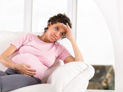 pregnant person with upset stomach