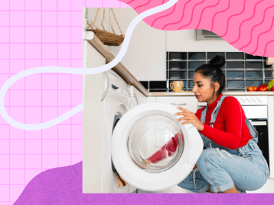 Woman loading washing machine