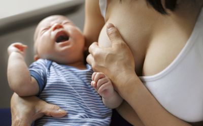 baby crying breastfeeding