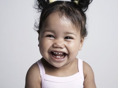 Smiling toddler with pig tails