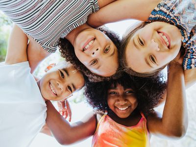 Children smiling down at a camera