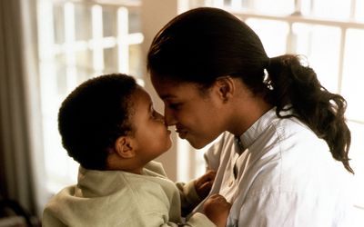 Mother rubbing noses with her son