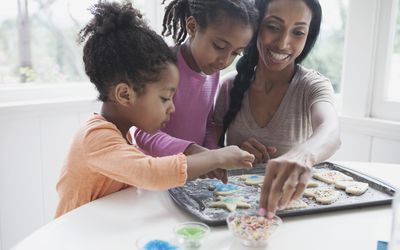 Mom baking with her kids.