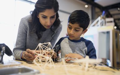 Mom and son working on science project