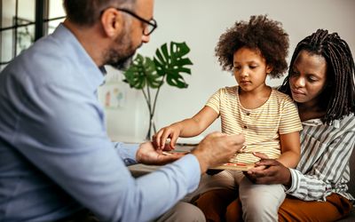 Mother and daughter in a therapy session with a psychologist