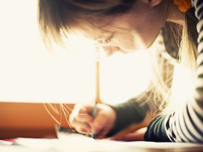 A picture of a child writing her name