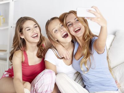 teen girls taking a selfie