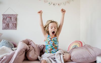 Child stretching and yawning as they wake up