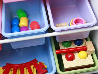 Colorful toy storage bin with toys inside