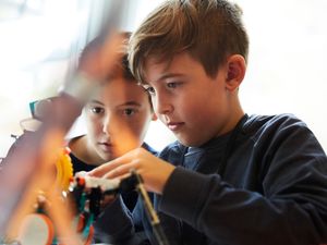 Kids working with robot in an in-store class