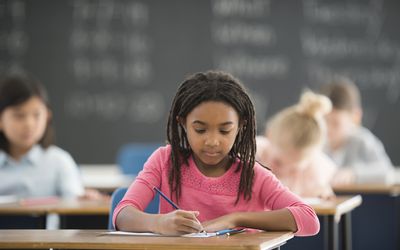 Girl writing at a desk