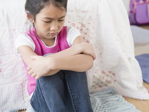 child pouting in time-out