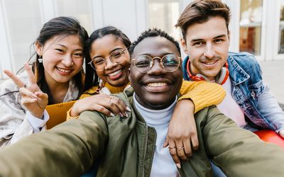 Group of 4 smiling teens