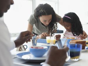 Family talking at breakfast table