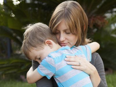 Mother hugging her son.