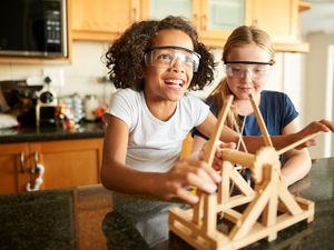 Girls Playing with Science Kit