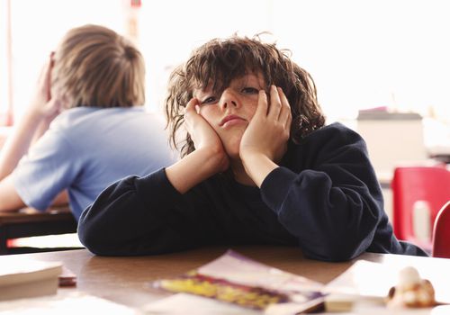 Student looking bored at school