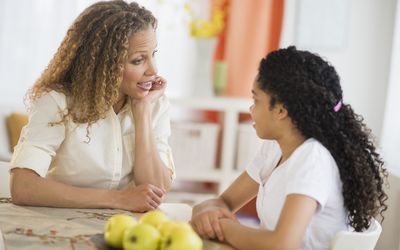 Mom talking to her daughter